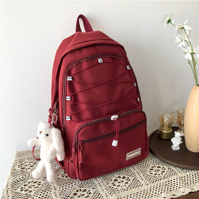 Sieviešu mugursoma ar šņorēm un priekšējo kabatu vairākās krāsās