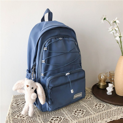 Sieviešu mugursoma ar šņorēm un priekšējo kabatu vairākās krāsās