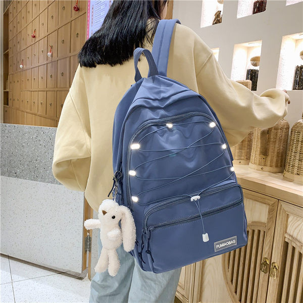 Sieviešu mugursoma ar šņorēm un priekšējo kabatu vairākās krāsās