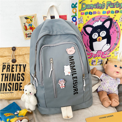 Sieviešu moderna mugursoma ar uzrakstu un rāvējslēdzēju vairākās krāsās