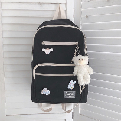 Vienkrāsaina sieviešu mugursoma ar aksesuāru un priekšējo kabatu