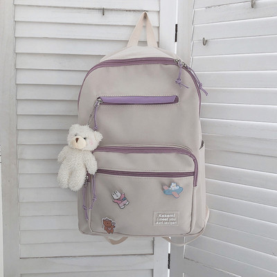 Vienkrāsaina sieviešu mugursoma ar aksesuāru un priekšējo kabatu