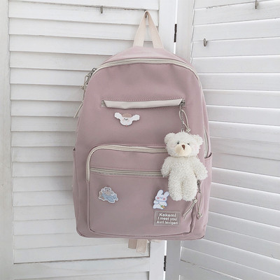 Vienkrāsaina sieviešu mugursoma ar aksesuāru un priekšējo kabatu