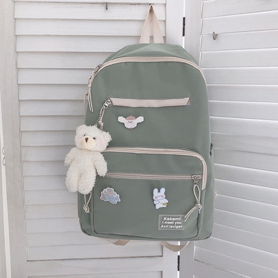 Vienkrāsaina sieviešu mugursoma ar aksesuāru un priekšējo kabatu