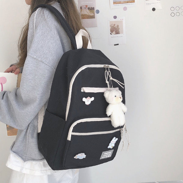 Vienkrāsaina sieviešu mugursoma ar aksesuāru un priekšējo kabatu