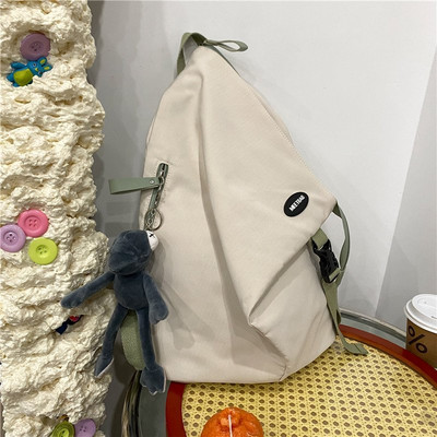 Sieviešu vienkrāsaina mugursoma ar aksesuāru un rāvējslēdzēju