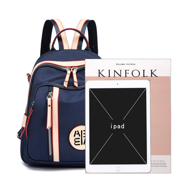 Rucsac de damă cu buzunar frontal și fermoar cu inscripție