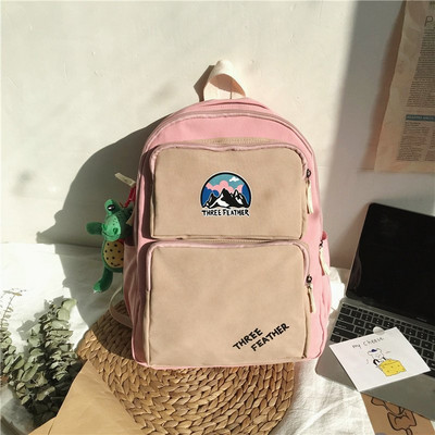 Vienkrāsaina mugursoma ar aksesuāru un priekšējo kabatu