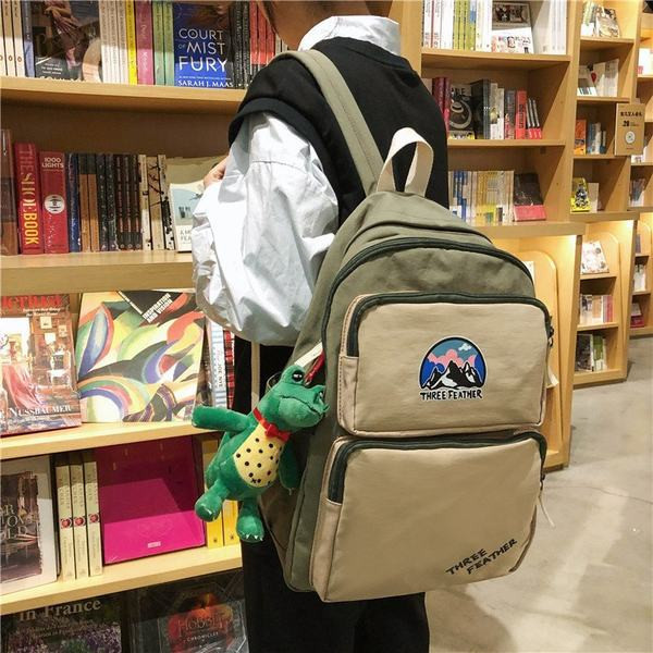 Vienkrāsaina mugursoma ar aksesuāru un priekšējo kabatu