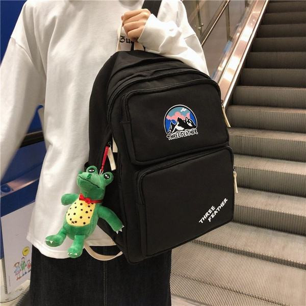 Vienkrāsaina mugursoma ar aksesuāru un priekšējo kabatu