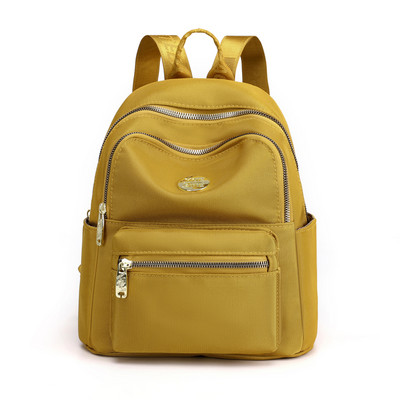 Jauna modeļa maza tekstila mugursoma ar metāla emblēmu