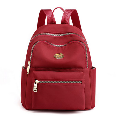 Jauna modeļa maza tekstila mugursoma ar metāla emblēmu