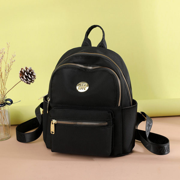 Jauna modeļa maza tekstila mugursoma ar metāla emblēmu