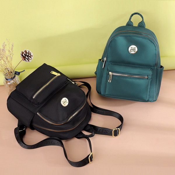 Jauna modeļa maza tekstila mugursoma ar metāla emblēmu