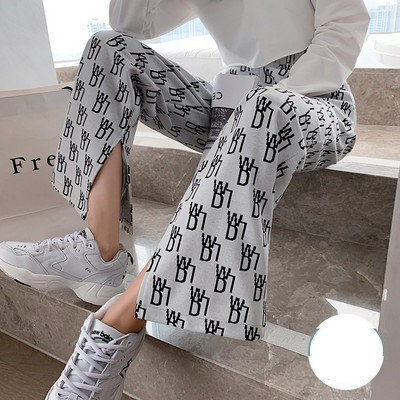 Modernas sieviešu plata modeļa bikses ar šķēlumu