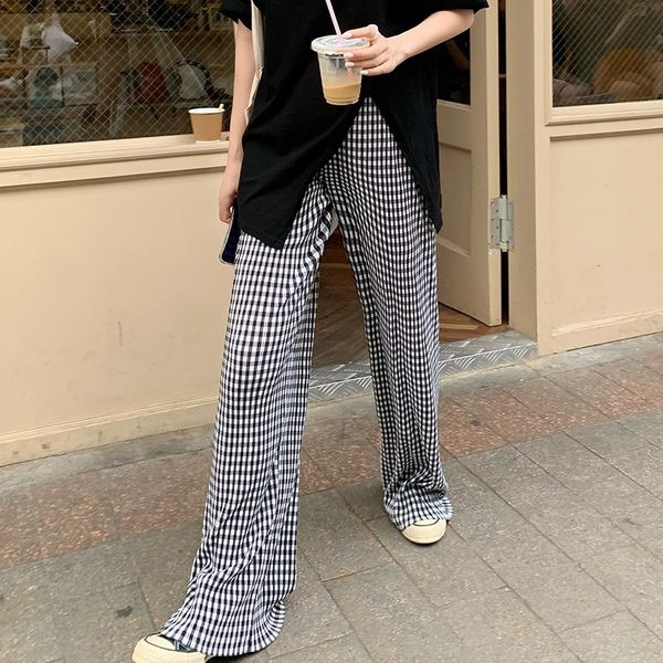 Sieviešu ikdienas rūtainu bikšu plats modelis