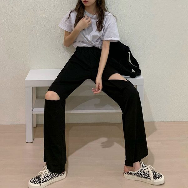 Sieviešu bikšu plats modelis ar saplēstiem motīviem