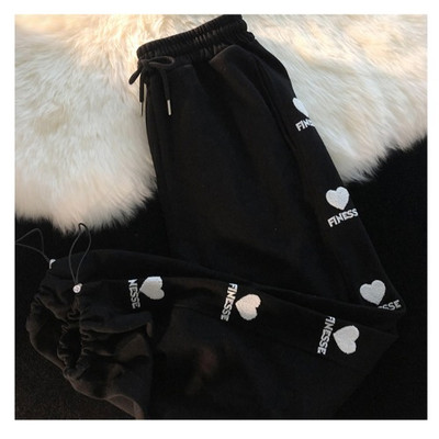 Ravni model ženskih hlača s vezom i vezicama