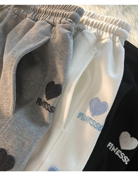 Ravni model ženskih hlača s vezom i vezicama