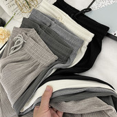 Sieviešu garas platas bikses ar elastīgu jostasvietu un saitēm