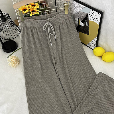 Sieviešu garas platas bikses ar elastīgu jostasvietu un saitēm