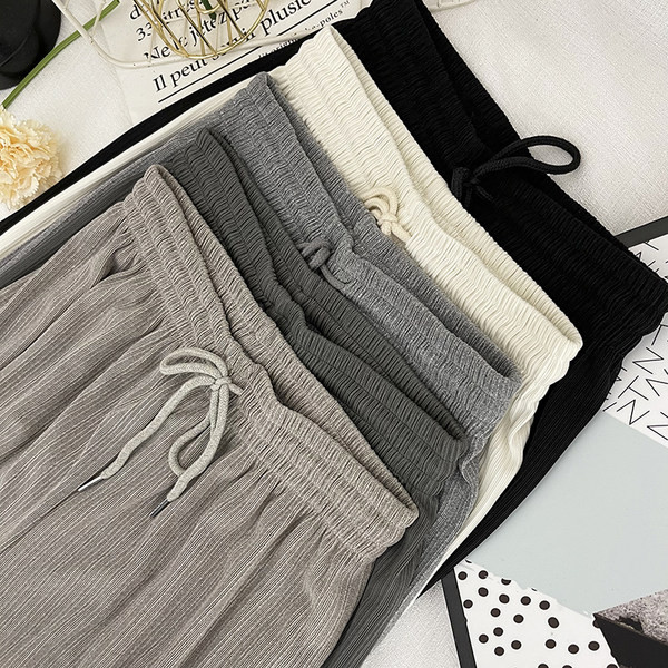 Sieviešu garas platas bikses ar elastīgu jostasvietu un saitēm