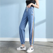 Sieviešu džinsi ar krāsainu rakstu un saitēm