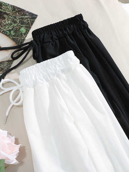 Sieviešu garās bikses ar saitēm un uzrakstu