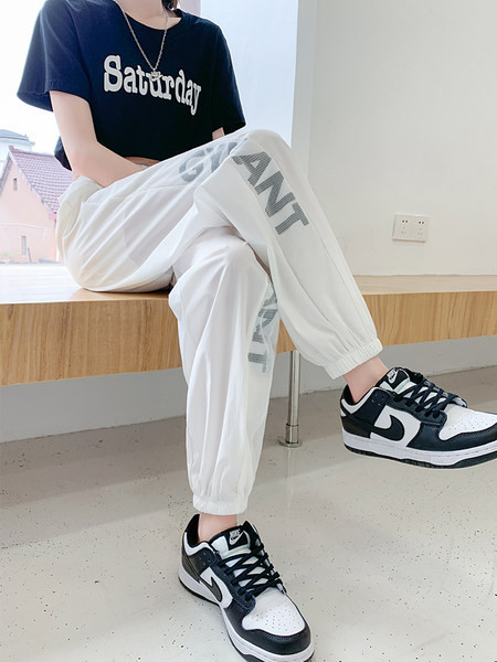 Sieviešu garās bikses ar saitēm un uzrakstu