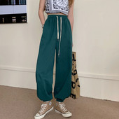 Plats sieviešu bikšu modelis ar saitēm