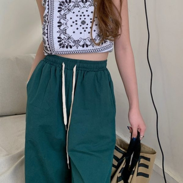 Plats sieviešu bikšu modelis ar saitēm