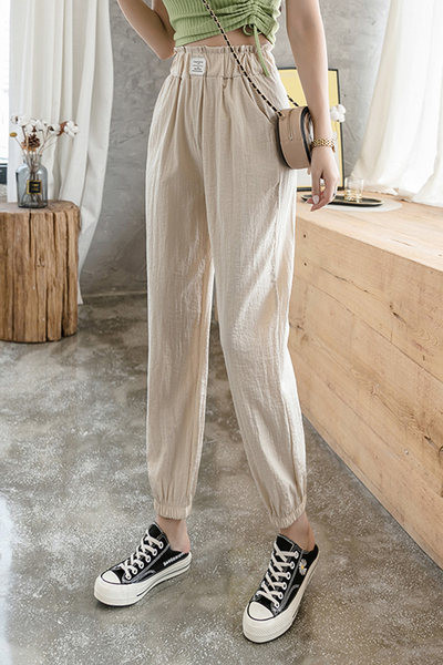 Sieviešu ikdienas bikses ar elastīgu jostasvietu un kabatām - divu krāsu