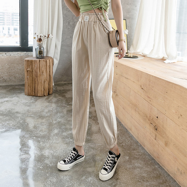 Sieviešu ikdienas bikses ar elastīgu jostasvietu un kabatām - divu krāsu