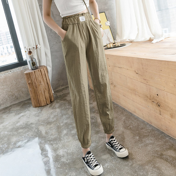 Sieviešu ikdienas bikses ar elastīgu jostasvietu un kabatām - divu krāsu