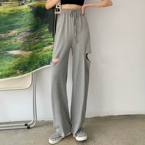 Ikdienas sieviešu bikses ar saitēm un saplēstiem motīviem