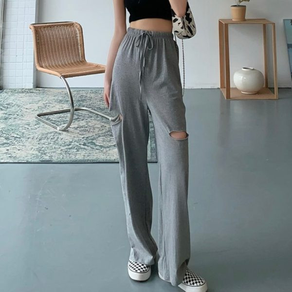 Ikdienas sieviešu bikses ar saitēm un saplēstiem motīviem