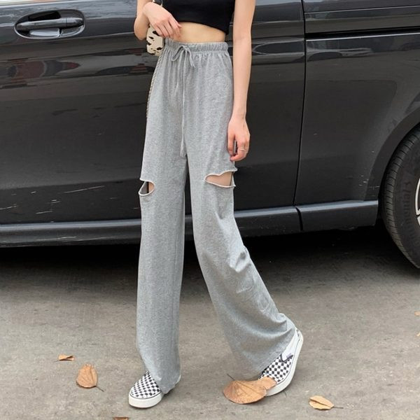 Ikdienas sieviešu bikses ar saitēm un saplēstiem motīviem