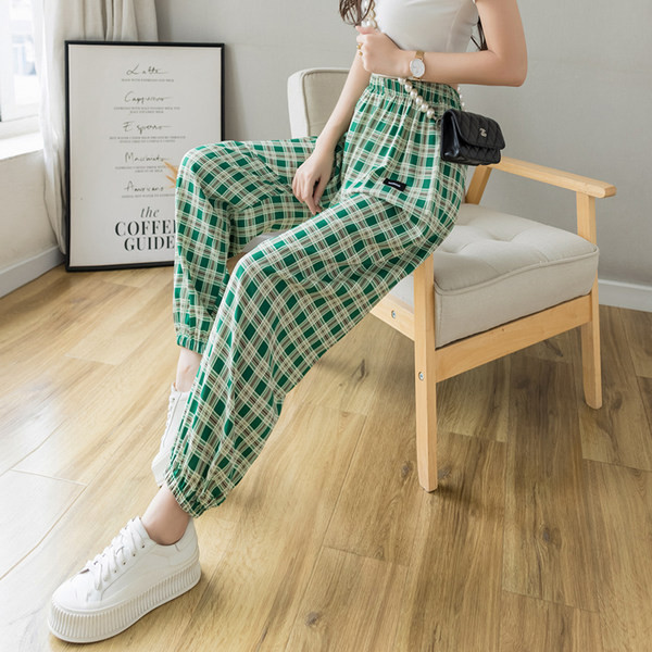 Rūtainas sieviešu bikses ar elastīgu jostasvietu trīs krāsās