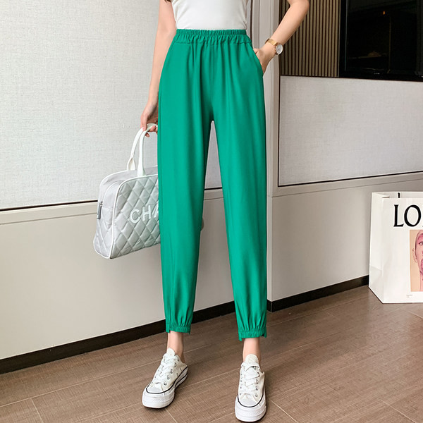 Sieviešu vienkrāsainas bikses ar elastīgu jostasvietu un kabatām