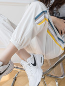 Sieviešu sporta bikses ar apmali baltā un melnā krāsā