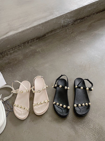 Aktuālās sieviešu sandales ar plakanām zolēm un pērlēm