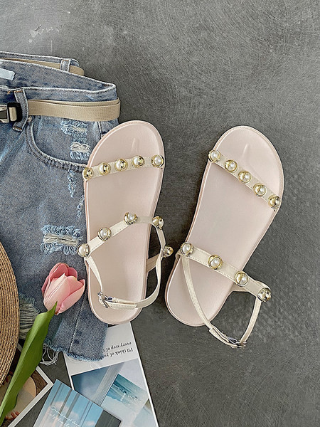 Aktuālās sieviešu sandales ar plakanām zolēm un pērlēm