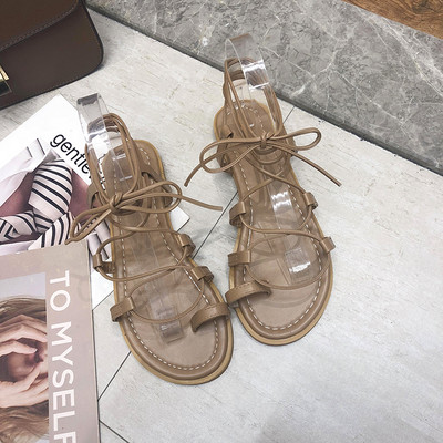 Sieviešu aktuālas sandales ar plakanām zolēm un mežģīnēm