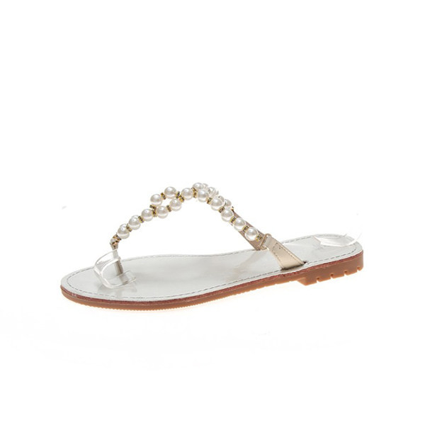 Sieviešu čības caur pirkstu ar dekoratīvām pērlēm