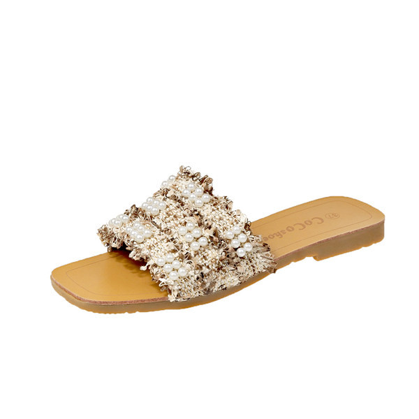Κομψές γυναικείες παντόφλες με επίπεδες σόλες και διακοσμητικά μαργαριτάρια