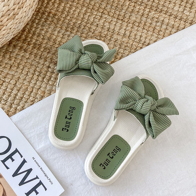 Παντόφλες για γυναίκες με επίπεδη σόλα και κορδέλα