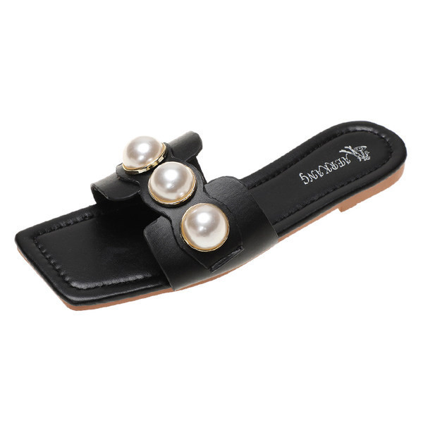 Κομψές παντόφλες με επίπεδες σόλες και διακοσμητικές μαργαριτάρια για γυναίκες