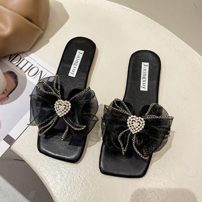 Papuci moderni cu talpa plata si floare decorativa pentru femei