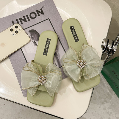 Papuci moderni cu talpa plata si floare decorativa pentru femei