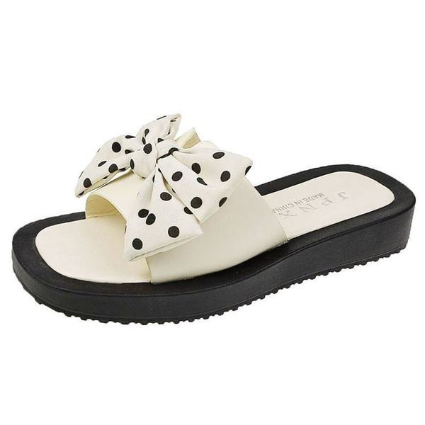 Νέο μοντέλο γυναικείες παντόφλες με επίπεδη σόλα και κορδέλα πουά